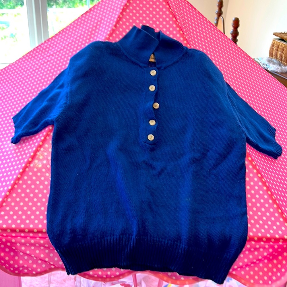 Short sleeve acrylic sweater worn but life left